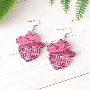 Pink cowgirl hat disco heart wooden earrings detail view for music festival and party styles.