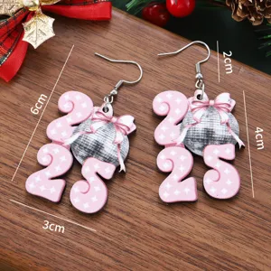 Detailed view of 2025 New Year wooden disco ball bow earrings on rustic wooden surface.