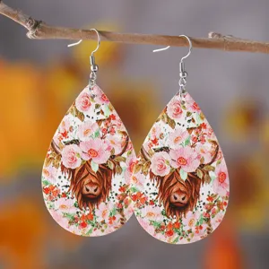 Teardrop PU leather earrings featuring a cute highland cow with pink floral crown print.