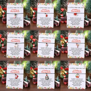 Set de pulseras de deseos navideños con dijes metálicos bonitos y tarjetas de felicitación.