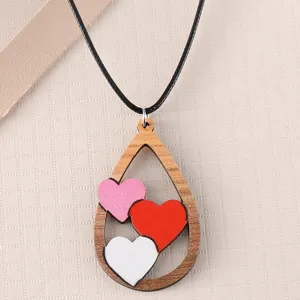 Wooden heart pendant necklace featuring colorful hearts on black cord for daily fashion.