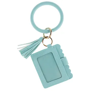 Mint green PU leather wristlet keychain with card holder and tassel, convenient daily accessory.