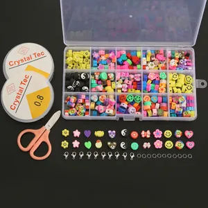 Detailed view of 15-grid clay beads DIY kit with elastic cord, scissors and assorted charms.