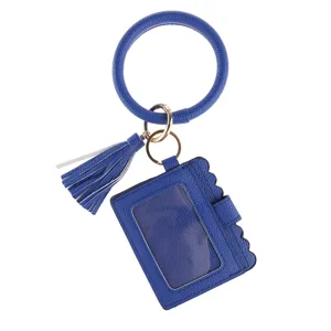 Blue PU leather keyring bracelet close-up detail showing tassel and clear ID card wallet pocket.