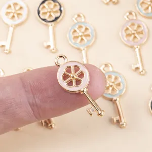 Close-up detail of colorful enamel key metal pendants, perfect for DIY jewelry and bag charms.