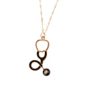 Gold alloy stethoscope pendant necklace with black enamel detail, elegant medical theme jewelry.
