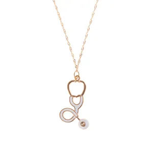 Gold nurse stethoscope necklace with white enamel pendant, simple medical jewelry.