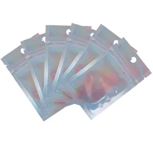 Close-up detail of holographic zip lock packaging bags, colorful iridescent foil pouches.