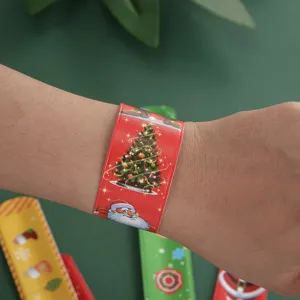 Christmas slap bracelet detail closeup showing festive Santa and tree print design clearly worn.