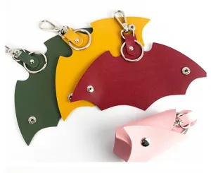 PU leather car key pouch with creative bat wing shape, metal keyring and snap button closure.