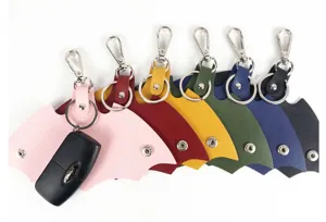 Colorful leather car key case with bat wing design, metal hook and snap button for keys.