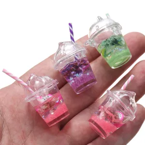 Miniature resin fruit drink cup pendant detail, transparent cup with straw and colorful glitter fill.