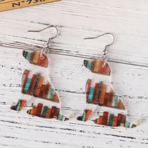 Acrylic dog book shelf earrings detail close-up, cute animal pendant jewelry for back to school.