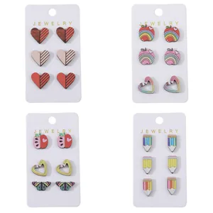 Wooden stud earrings detail view, featuring cute heart, apple, pencil and butterfly designs.