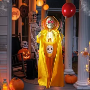 Ηλεκτρικός σκελετός Halloween με κίτρινη κάπα, κόκκινο μπαλόνι και φωτεινά μάτια.