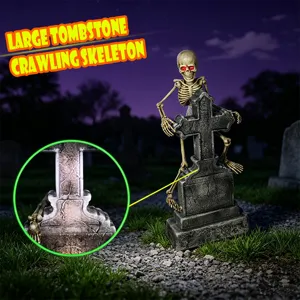 Halloween glowing tombstone crawling skeleton prop detail view with red eyes spooky decor.