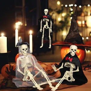 Halloween skeleton decoration set featuring bride and groom props with capes in cozy candle light.