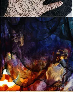 Black creepy cloth detail showing stretched mesh texture and spooky Halloween skull scene decor.