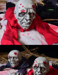 Halloween crawling zombie prop detail showing scary glowing eyes and creepy face design.
