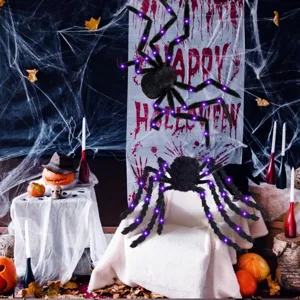 Halloween glowing plush spider with purple LED lights and scary red eyes for party decor.