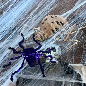 Halloween glowing plush spider decoration with purple LED lights, spooky outdoor hanging prop.