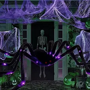 Giant Halloween fuzzy spider with purple LED lights and red glowing eyes for outdoor decor.