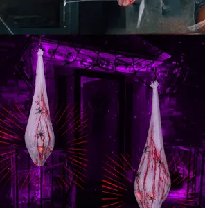 Halloween hanging bloody spider cocoon decoration with glowing lights and creepy sound effects.