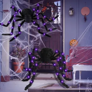 Close-up detail of scary fuzzy Halloween spider decoration with purple lights for spooky party props.