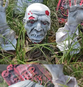 Halloween zombie grondstaaf set met griezelige schedel en handen voor enge buitendecoratie op het gras.