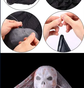 Décoration de fantôme suspendu d'Halloween avec masque de crâne et filet, vue détaillée.