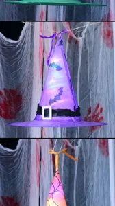 Detailed view of the Halloween LED glowing witch hat featuring spooky bat patterns for party decor.