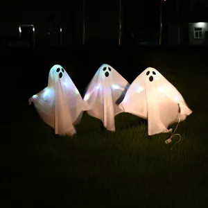 Outdoor Halloween LED glowing ghost set detail, 3-piece lawn decoration for night party.