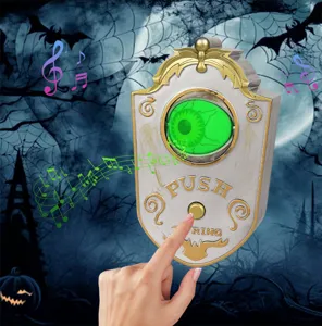 Vista detallada del accesorio de timbre con ojo luminoso de Halloween que muestra botón y música.