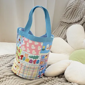 Sac seau en toile mignon pour femmes, sac à main cylindrique tendance avec motif adorable.