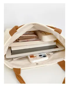 Large capacity corduroy tote bag with sturdy handles, perfect for daily shopping and work.