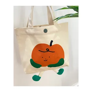 Schöne Canvas Tragetasche mit niedlichem Orangendesign, geräumige Schultertasche für den Alltag.