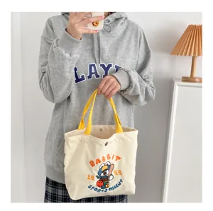 Corduroy tote bag with cute rabbit embroidery and yellow handles, perfect casual handbag for daily.
