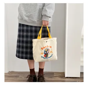 Cute corduroy tote bag with yellow straps and rabbit embroidery, ideal for daily casual use.