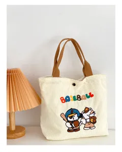 Cute corduroy tote bag for women with baseball cartoon embroidery and brown top handles.
