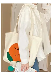 Lässige weiße Canvas-Tragetasche mit niedlicher orangener Cartoon-Grafik für den Alltag.