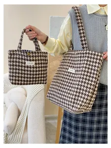 Detailed view of women's autumn winter houndstooth tweed tote bag and handbag set.