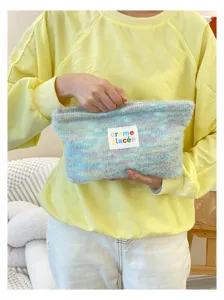 Knitted plush makeup storage bag, soft fuzzy cosmetic pouch with patch, portable daily bag.