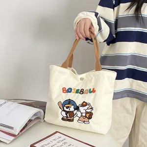 Corduroy cartoon embroidered tote bag, large capacity casual handbag for women daily use.