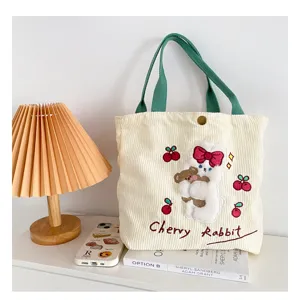 Cute corduroy tote bag with rabbit embroidery, green straps, casual canvas handbag for women.