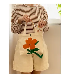 Süße Canvas Tragetasche mit lustigem orangefarbenem Blumenprint, lässige Handtasche für Damen.