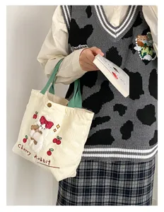 Cute corduroy small tote bag with rabbit embroidery, green handles, casual daily handbag.