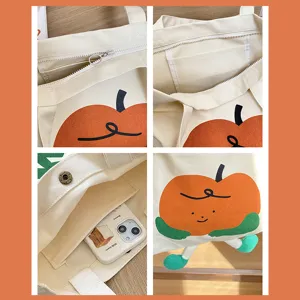 Große Canvas-Tragetasche mit niedlichem Orangen-Charakter-Design und praktischen Innentaschen.