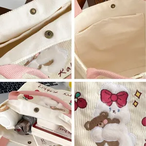 Cute corduroy tote bag for women, soft plush rabbit embroidery handbag with pink handles.