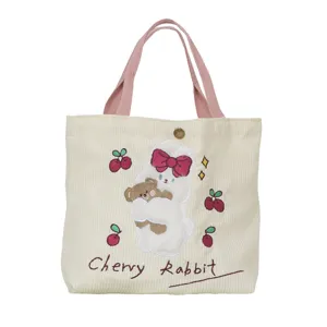 Cute corduroy handbag with pink handles, embroidered rabbit and cherry design for women and girls.