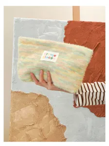 Fluffy pastel striped knit makeup bag, soft plush cosmetic pouch with cute woven label.